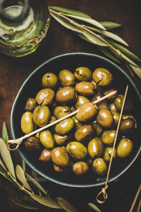 Flat-lay of fresh harvested pickled green Mediterranean olives in bowl - Stock Photo - Images