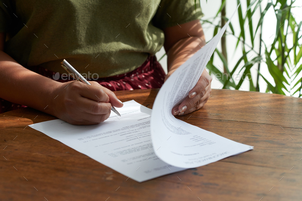 Female Entrepreneur Signing Contract - Stock Photo - Images