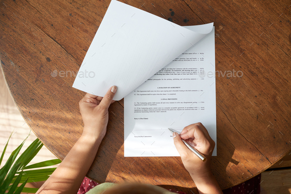 Businesswoman Studying Contract - Stock Photo - Images