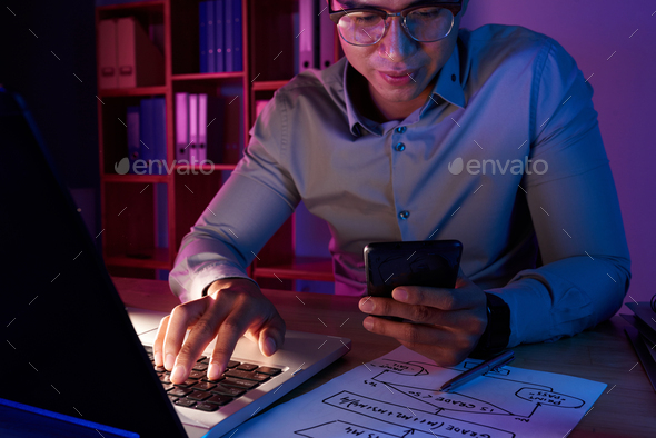 Asian Programmer Working on Computer App - Stock Photo - Images