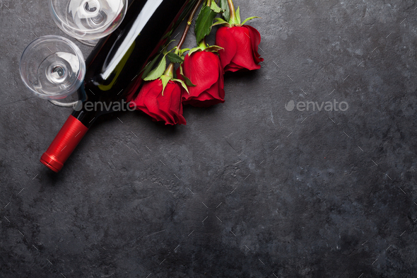 Valentines day card with rose flowers bouquet and wine - Stock Photo - Images
