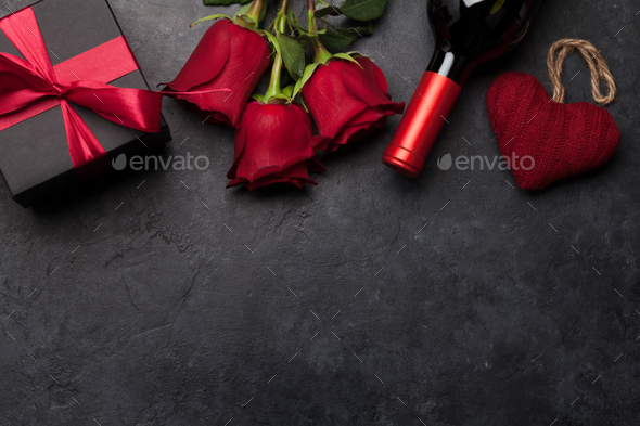 Valentines day gift box, wine and roses - Stock Photo - Images