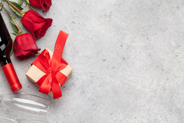 Valentines day with gift, wine and roses - Stock Photo - Images