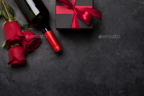 Valentines day gift box, wine and roses - Stock Photo - Images