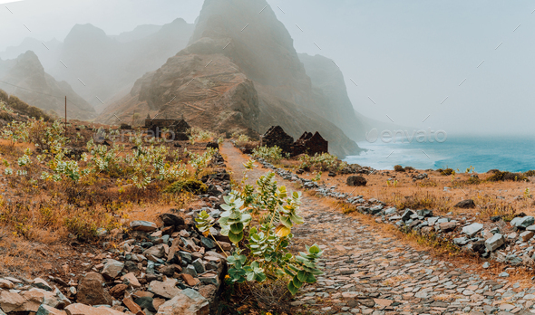 Panoramic view of stony hiking path to Ponta do Sol over amazing arid Aranhas valley with huge - Stock Photo - Images