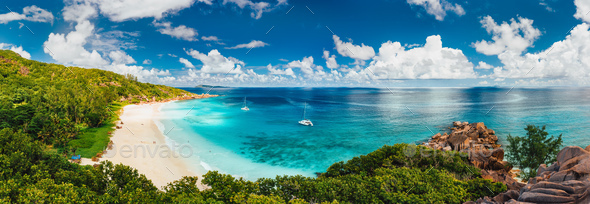 Aerial Pano of Grand Anse beach at La Digue island in Seychelles. White sandy beach with blue ocean - Stock Photo - Images