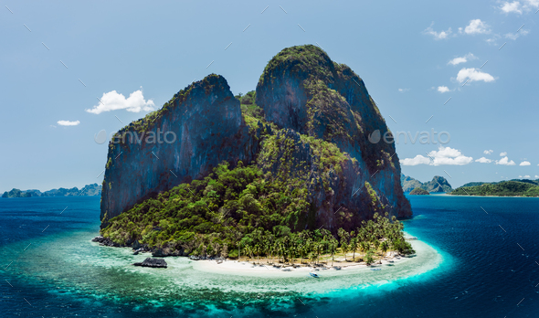 Aerial drone view of tropical Pinagbuyutan Island and ipil beach in blue ocean El Nido, Palawan - Stock Photo - Images