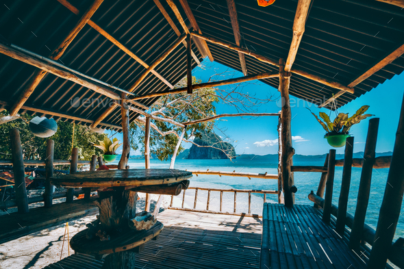Tropical getaway remote panorama of impressive Pinagbuyutan island from the native wood and bamboo - Stock Photo - Images