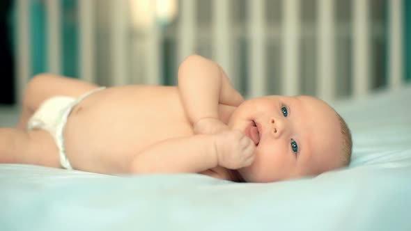 Beautiful Babe Lies Naked in Diapers alt