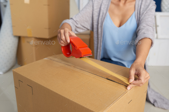 Woman Packing Carton Box