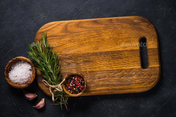 Food cooking background with herbs and spices on black - Stock Photo - Images