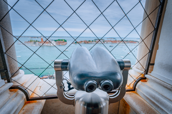 Binoculars in the Clock Tower of Venice, Italy with Chiesa di San Giorgio Maggiore blurred in - Stock Photo - Images