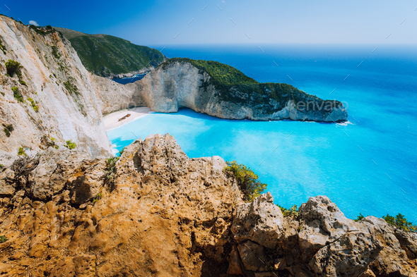 Rock Cliffs in front of Navagio beach Zakynthos. Shipwreck bay with turquoise water and white sand - Stock Photo - Images