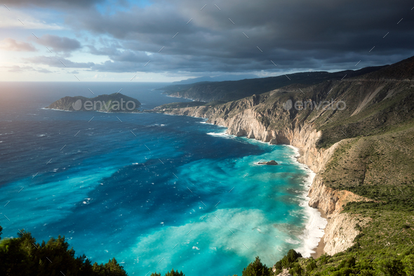 Dreamy atmosphere on picturesque jagged coastline of Kefalonia. Overcast weather, deep clouds - Stock Photo - Images