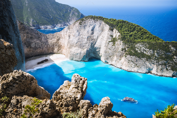Navagio beach or Shipwreck bay with turquoise water and pebble white beach. Famous landmark location - Stock Photo - Images