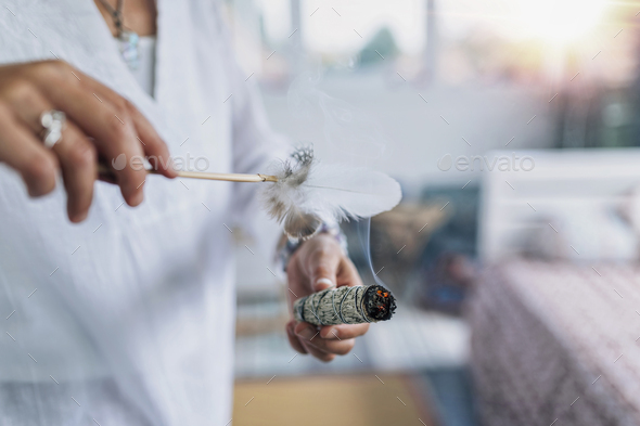 Smudging or Space Cleansing with Sage for Removal of Negative Energies, Spirituality and Health - Stock Photo - Images