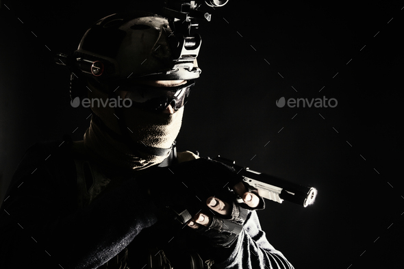 Police SWAT team fighter aiming service pistol - Stock Photo - Images