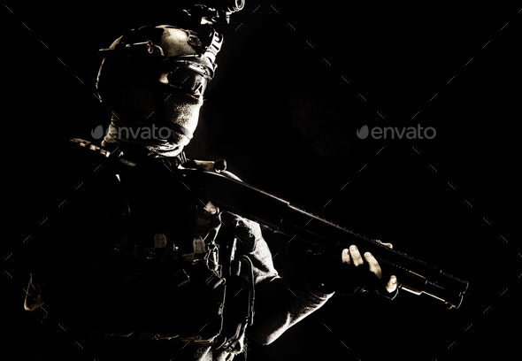 Army elite troops soldier low key studio portrait