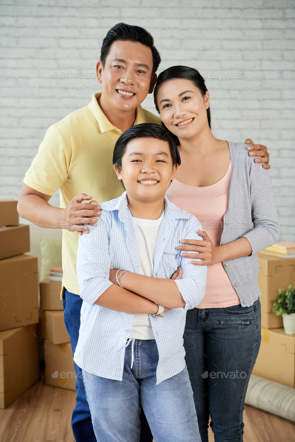 Asian Family Moving to New Apartment - Stock Photo - Images
