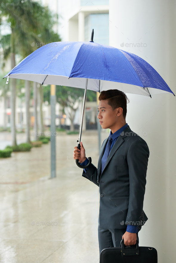 Handsome Asian Businessman with Umbrella - Stock Photo - Images