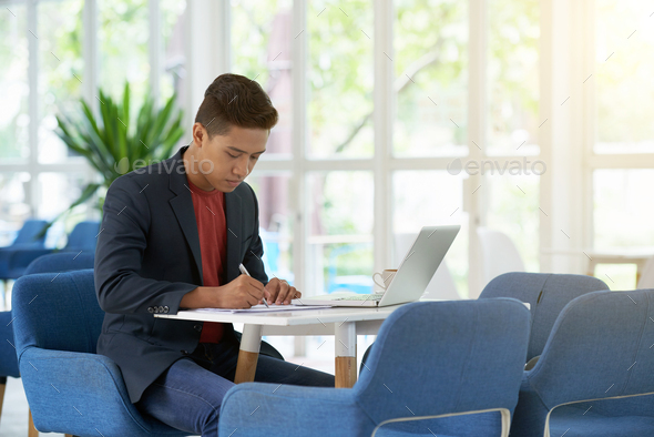 Young Entrepreneur Preparing for Negotiations - Stock Photo - Images