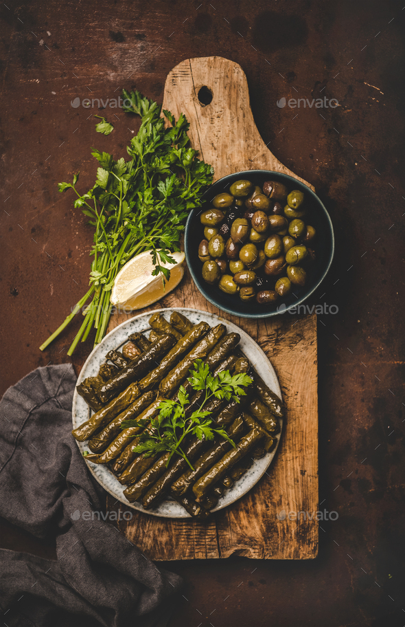 Flat-lay of traditional turkish Dolma meze or snack on board - Stock Photo - Images