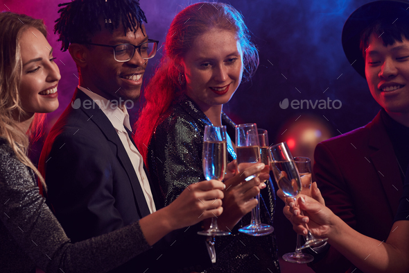Friends Drinking Champagne in Nightclub - Stock Photo - Images