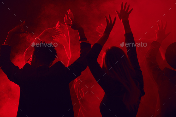 Crowd Dancing in Red Nightclub - Stock Photo - Images
