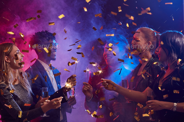 People Lighting Sparklers at Nightclub - Stock Photo - Images