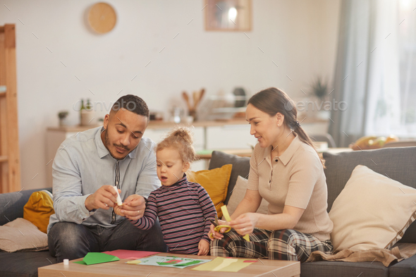Modern Family Playing with Cute Little Daughter at Home - Stock Photo - Images