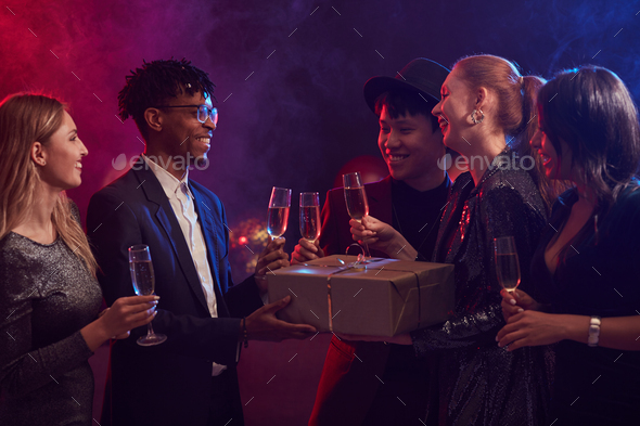 Friends Exchanging Presents in Nightclub