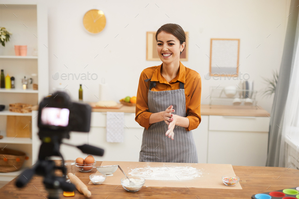 Joyful Woman Filming Baking Video in Kitchen - Stock Photo - Images