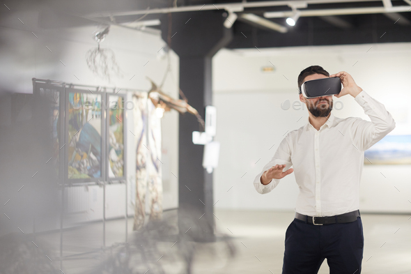 Bearded Man Using VR in Museum - Stock Photo - Images