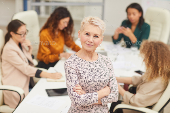 Confident Mature Businesswoman With Arms Crossed - Stock Photo - Images