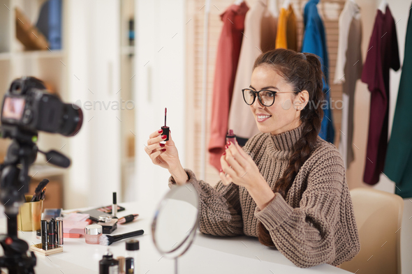 Young Woman Filming Makeup Tutorial Video - Stock Photo - Images