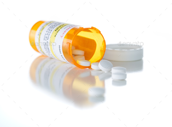 Non-Proprietary Medicine Prescription Bottle and Spilled Pills Isolated on White - Stock Photo - Images