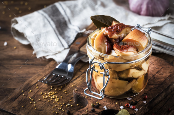 Salted or marinated forest white mushrooms boletus - Stock Photo - Images
