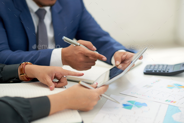 Financial Managers Wrapped up in Work - Stock Photo - Images