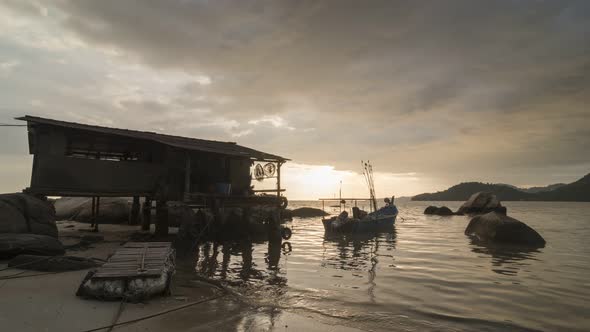 Timelapse amazing sunset at Fisherman hut near seaside.  alt