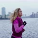 Beautiful Blonde Girl Runs Along Urban Embankment - VideoHive Item for Sale