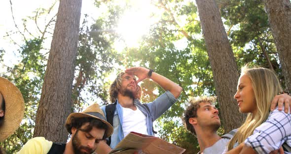 A group of friends interacting and watching maps alt