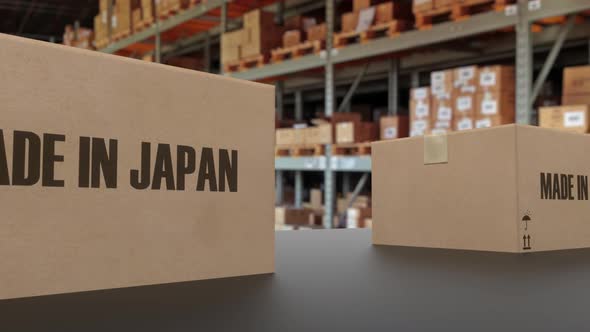 Boxes with MADE IN JAPAN Text on Conveyor alt
