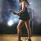 Beautiful woman with red hair playing electric guitar - PhotoDune Item for Sale