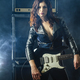Beautiful woman with red hair holding electric guitar - PhotoDune Item for Sale