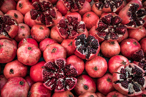 Many pomegranate cut in half, pomegranate background