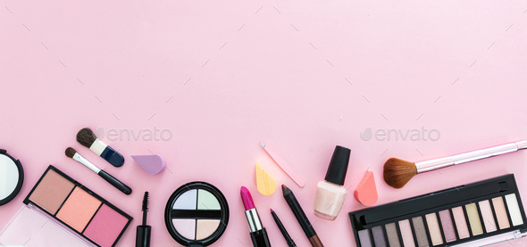 Make up cosmetics products against pink color background, banner Stock  Photo by rawf8