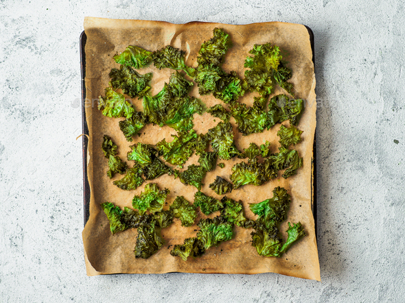 Kale Chips with salt on oven-tray, top view