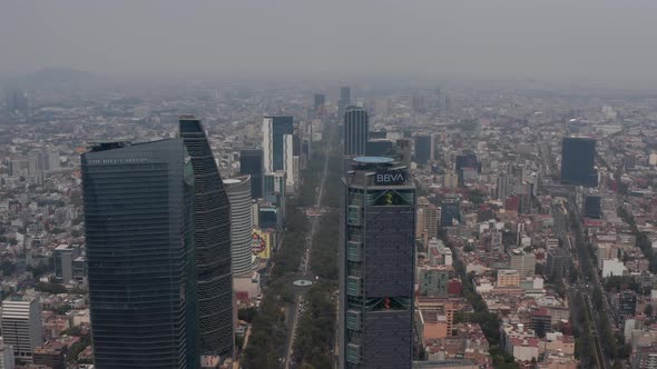 Aerial View of Wide Long Straight Street Leading Between Modern Tall Office Buildings alt