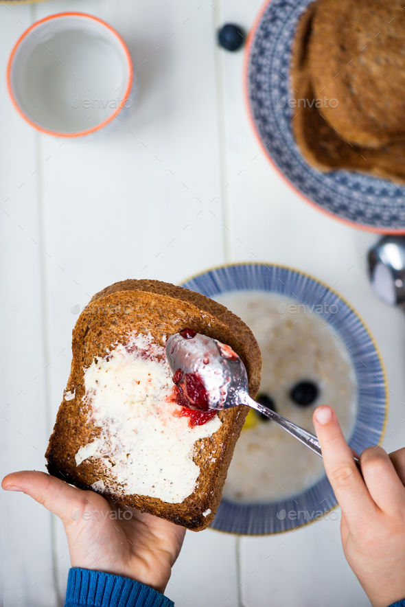 Tasty Family Breakfast with Toasts, Porridge, Berries - Stock Photo - Images