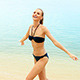 Young Woman Spending Free Time On The Beach - VideoHive Item for Sale